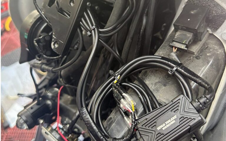 MDL auxiliary light wiring being installed on a motorcycle