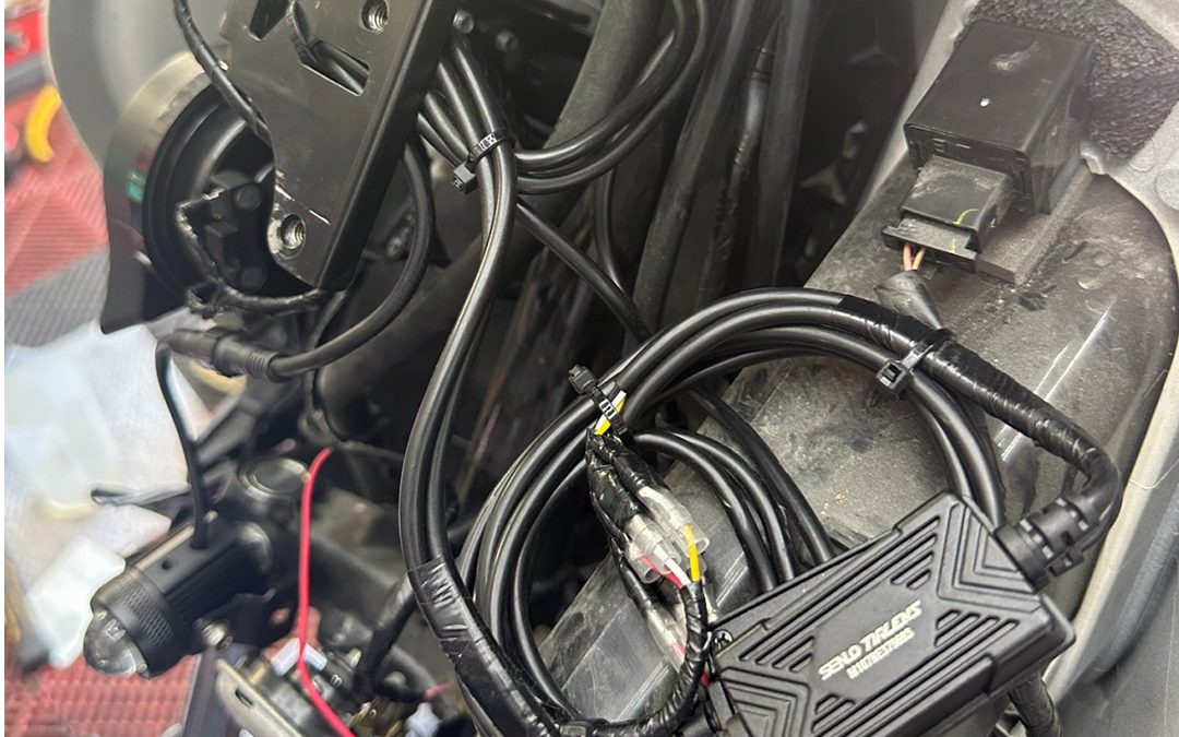 MDL auxiliary light wiring being installed on a motorcycle