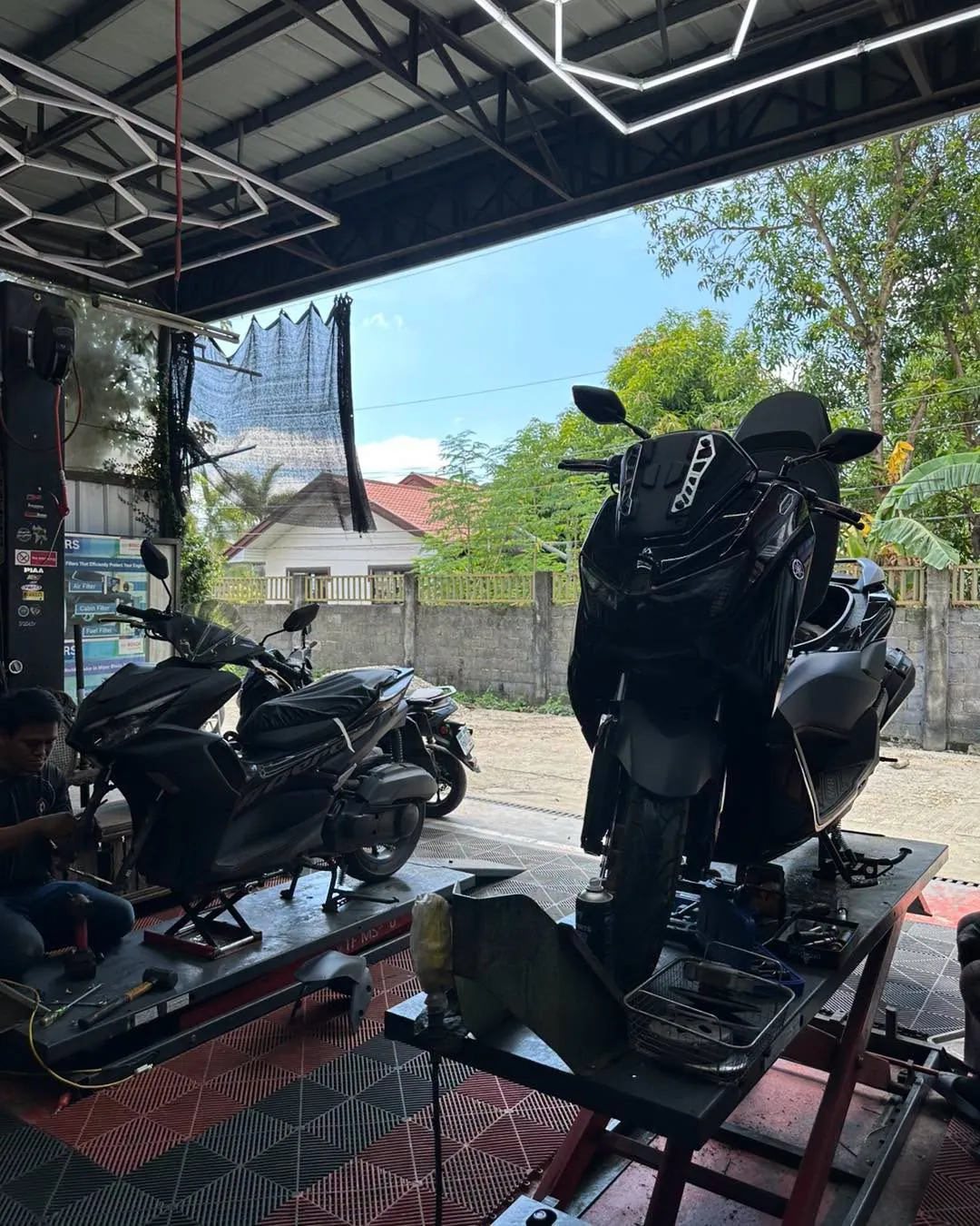 Yamaha NMAX on the service lift at MotoNorte, Batac City