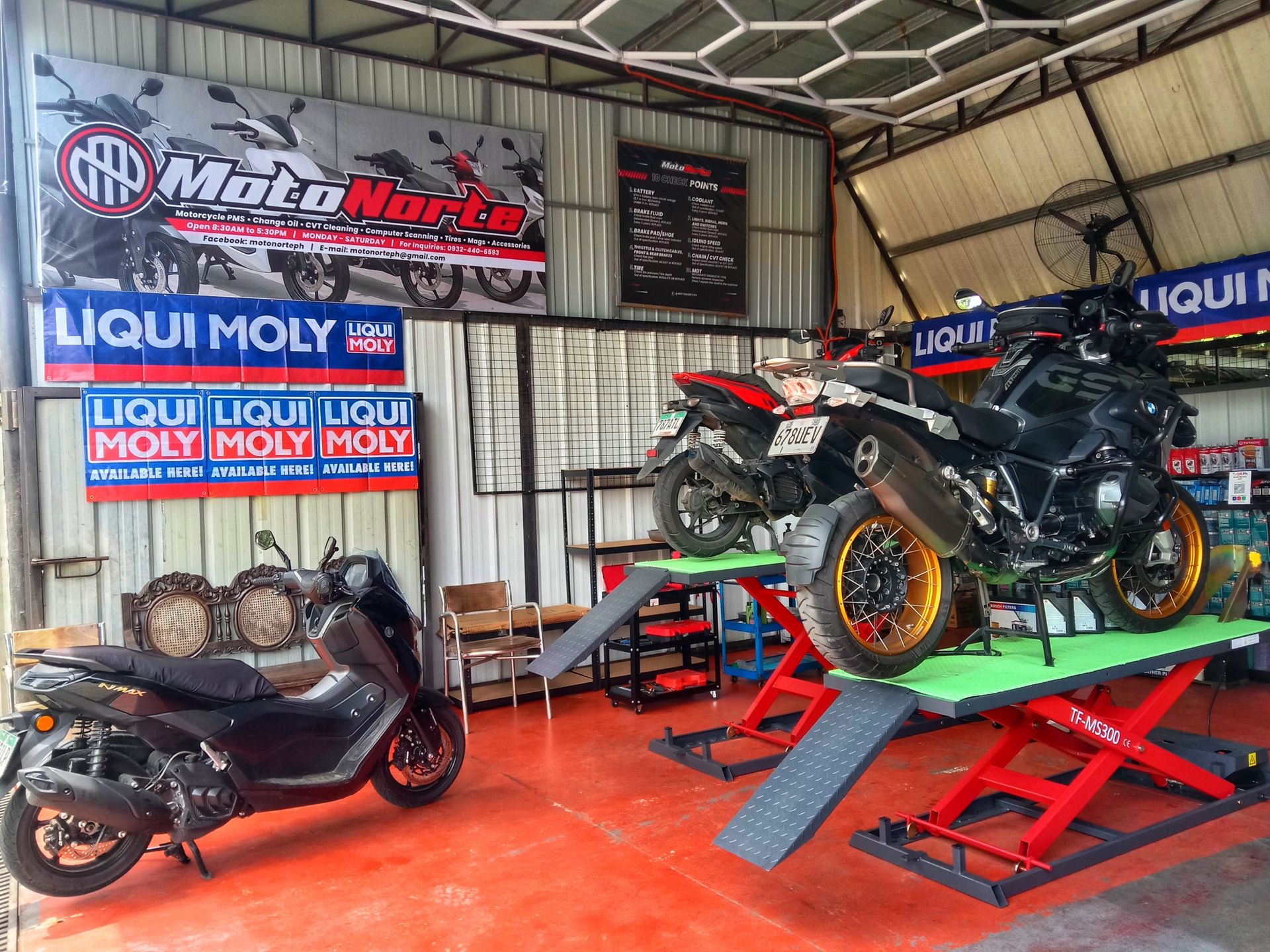 Inside the MotoNorte shop in Batac City, with bikes on the service lifts
