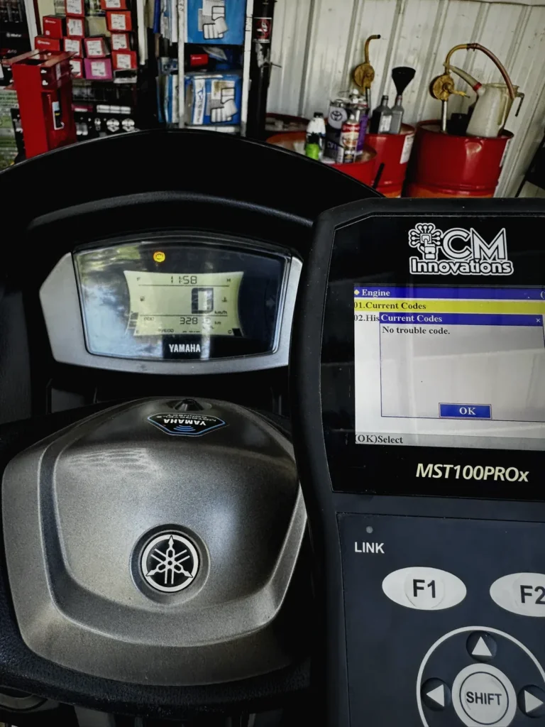 Diagnostic scanner connected to a Yamaha scooter at MotoNorte
